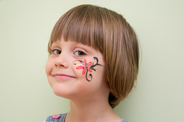 Little girl with flower face paint