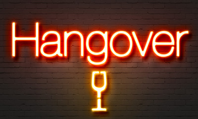 Hangover neon sign on brick wall background.