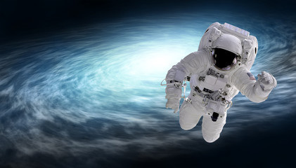 Wall Mural - cosmonaut and spiral galaxy, elements of this image furnished by nasa