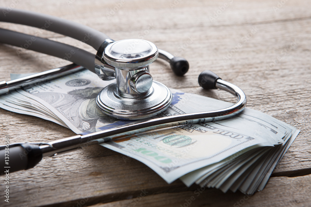 health insurance concept - stethoscope over the money - obrazy, fototapety, plakaty 