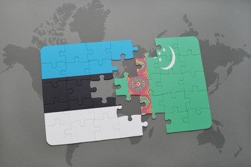 puzzle with the national flag of estonia and turkmenistan on a world map
