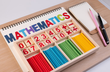 Wall Mural - Educational kids math toy wooden board stick game counting set in kids math class kindergarten. Math toy kids concept.