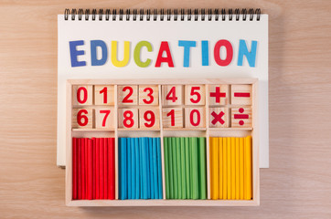 Wall Mural - Educational kids math toy wooden board stick game counting set in kids math class kindergarten. Math toy kids concept.