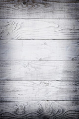 horizontal planks of white painted worn part of fence or door