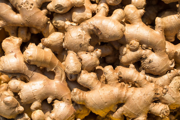 Fresh ginger at a market stall. Selective focus.