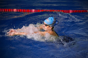 Poster - Young woman swimmer