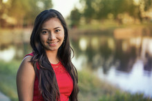 Portrait Of A Young Filipino Woman In A City Park In Autumn; St. Albert, Alberta, Canada