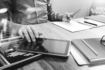 Aufkleber - Website designer holding smart phone and working computer digital tablet on wood table
