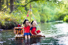 Kids Playing Pirate Adventure On Wooden Raft