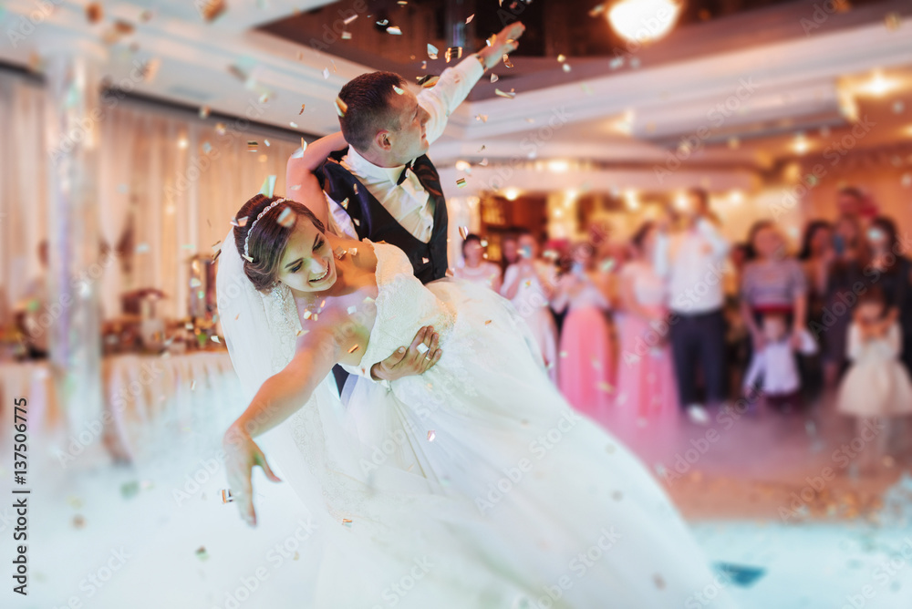 Happy bride and groom their first dance - obrazy, fototapety, plakaty 