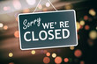 Sorry we are closed sign on abstract background