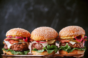 Wall Mural - a delicious and juicy burger home in a rustic style with a big chop of beef