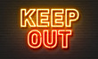 © ibreakstock - Keep out neon sign on brick wall background.