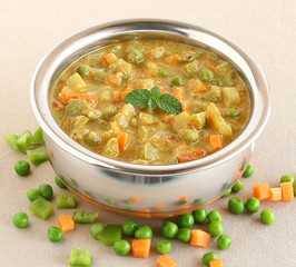 Wall Mural - Indian food vegetable curry, made from carrot, capsicum, peas and other items, as a side dish for food like dosa and chapati, in a bowl.