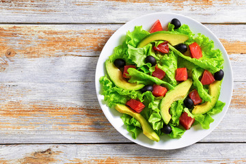 Poster - salad of  lettuce, avocado, chunks of salted salmon