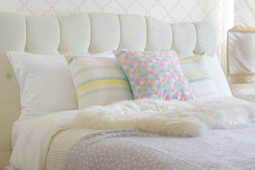 Wall Mural - Sweet colorful pillows setting on bed with puffy scarf