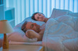 © realstock1 - The pair sleeping together on the bed