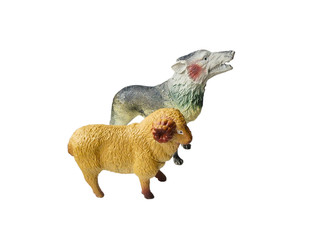 Toy wolf and a sheep on a white background