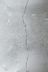 Crack in cement floor from shrinkage of house. The problem of construction. Background.