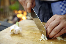Person Cutting Garlic