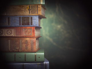 Poster - Stack of old books on green vintage background.