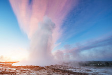 Strokkur Geyser Eruption In Iceland. Fantastic Colors Shine Thro