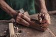 © Lumi Images - Senior carpenter in his workshop using wood plane, Karanac, Baranja, Croatia