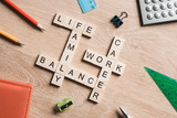 Fototapeta  - Words work life balance and family on table collected with wooden cubes