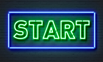 Wall Mural - Start neon sign on brick wall background.