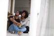© .shock - African American couple relaxing in new house