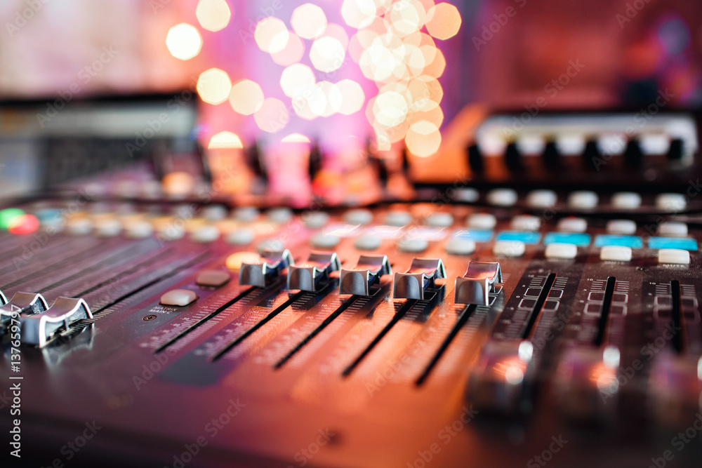 od adjusters and red buttons of a mixing console. It is used for audio signals modifications to achieve the desired output. Applied in recording studios, broadcasting, television. - obrazy, fototapety, plakaty 