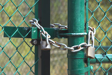 Lock And Chain On Fence