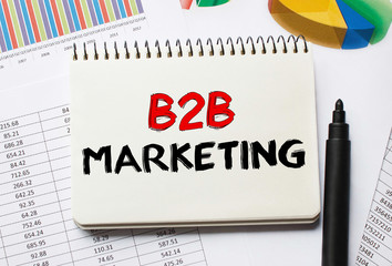 Poster - notebook with toolls and notes about b2b marketing