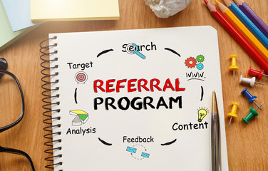 Poster - notebook with toolls and notes about referral program