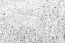 Closeup Of A White Shaggy Carpet Texture In Black&white. 