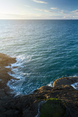  Coast in north Devon. Near the town of Ilfracombe. Evening. The waves beat against the shore rocks. View from above. UK