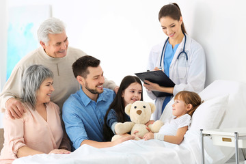 Poster - Family visiting little girl in hospital