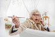 © Yakobchuk Olena - Surprised mature lady in entertaining in bath