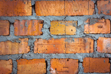 Brick wall close. Red, yellow and gray colors. Background.