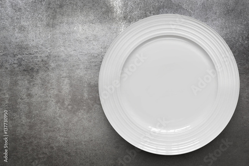 Fotografie, Obraz Empty White Plate over Gray Slate Top View