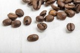 Fototapeta Boho - Brown coffee beans on the table