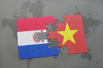 puzzle with the national flag of paraguay and vietnam on a world map