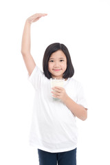 Wall Mural - Asian girl holding glass of milk on white background