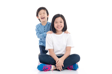 Wall Mural - asian children sitting on white background