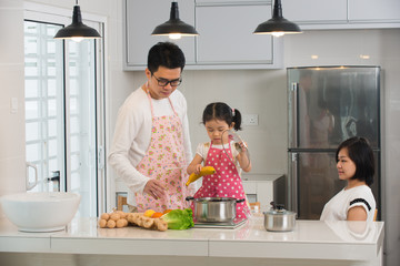 Wall Mural - asian family cooking at kitchen