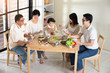 © wong yu liang - chinese family having lunch