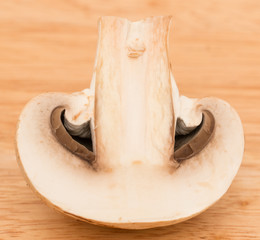 champignon mushrooms on a wooden background