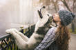 Image of young girl with her dog, alaskan malamute, outdoor