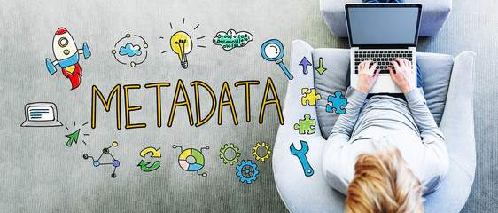Wall Mural - metadata text with man using a laptop