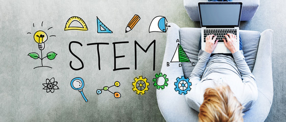 Wall Mural - stem text with man using a laptop